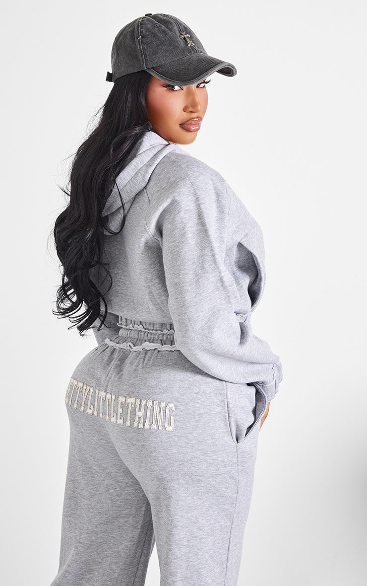 https://cdn-img.prettylittlething.com/9/4/b/8/94b873e35611838650353548ac3f68f9afa2a49e_CNK5745_2_shape_grey_marl_distressed_elasticated_waistband_cropped_hoodie.jpg